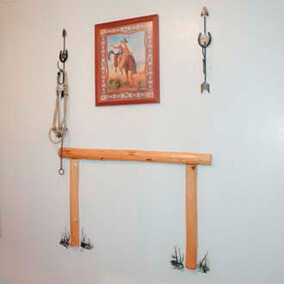 Motel room wall decorated with pine wood and horseshoes